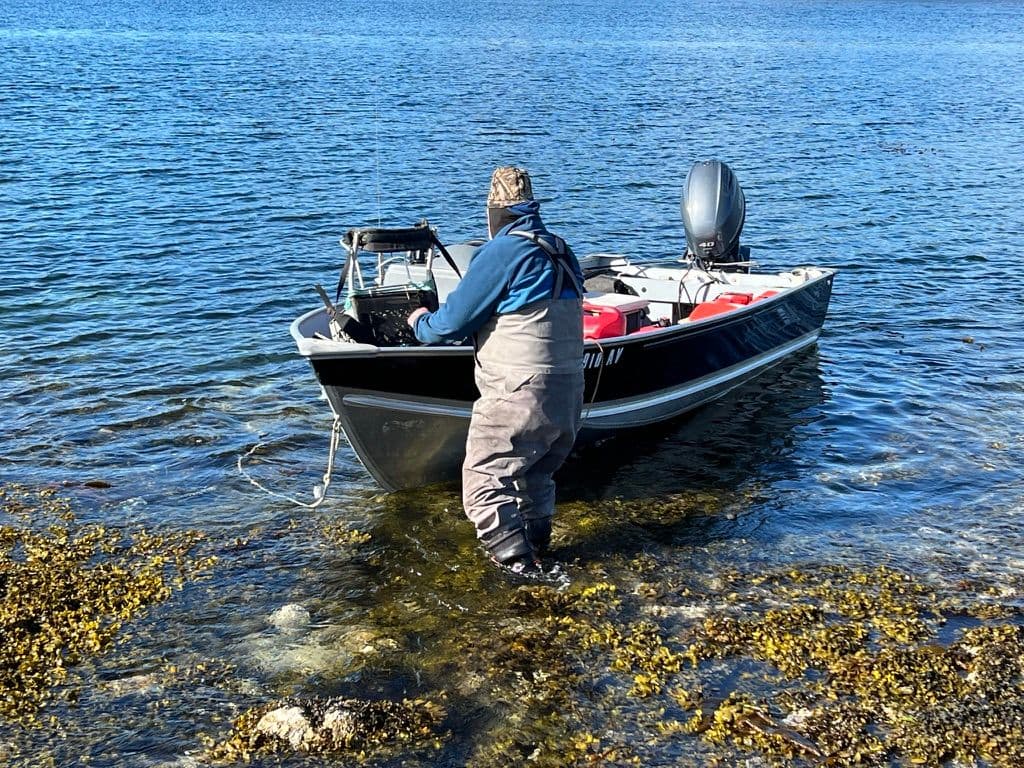 Captain Jim getting his skiff close to shore.