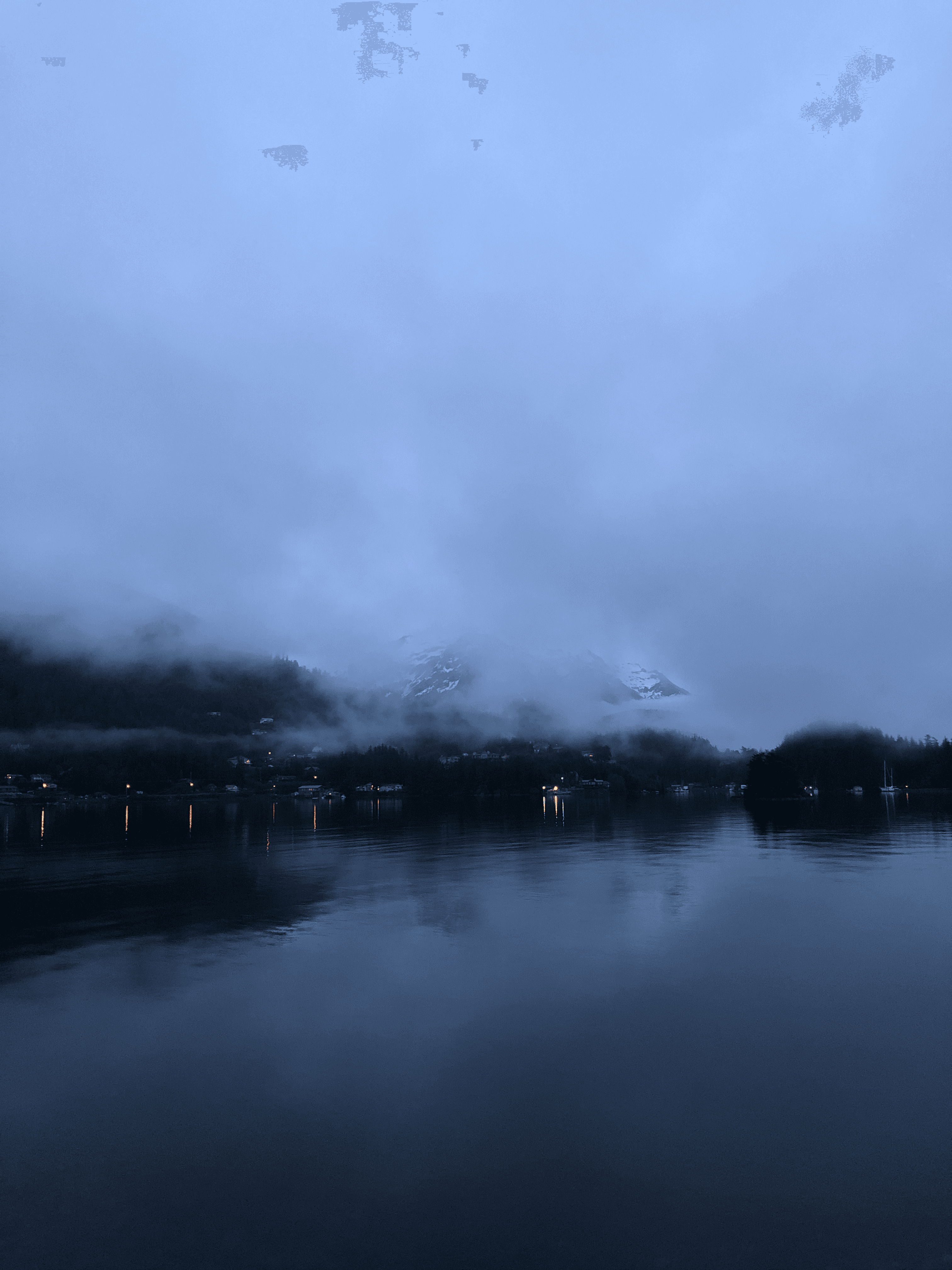 Sitka viewed from the water in a foggy day.